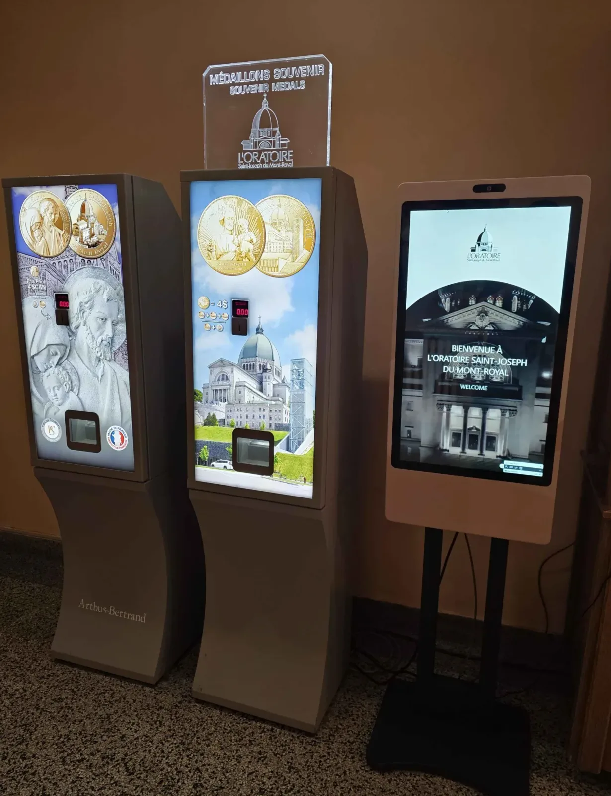 Donation kiosk and souvenir medals in a reception area